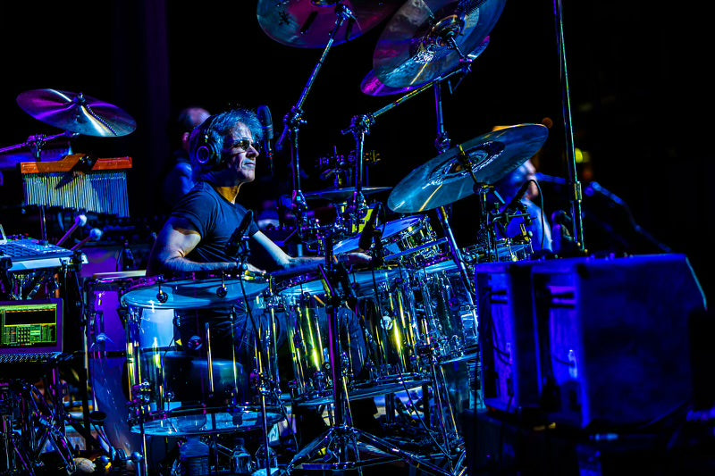 Denny Fongheiser playing live behind his drum kit.